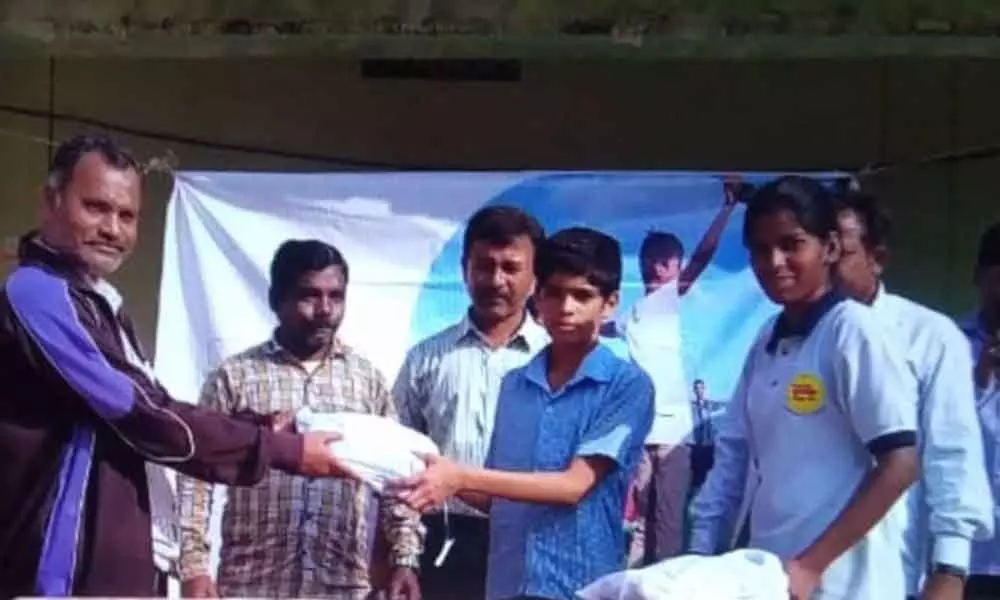 Old Bowenpally: NGO distributes shoes to students