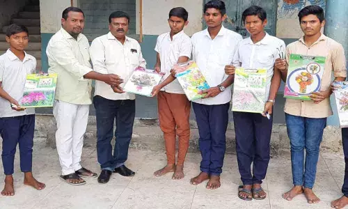 Law students distribute exam material to 10th Class students