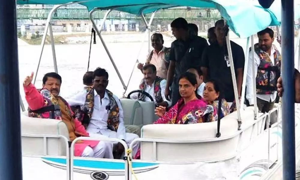Medak MP drives boat in lake at Siddipet