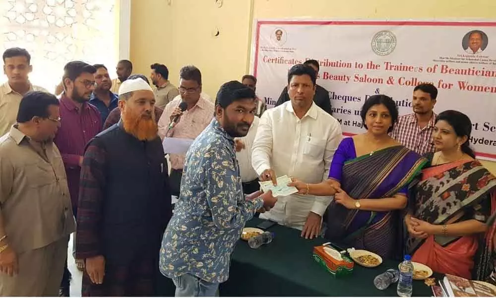 Hyderabad: TMFC distributes cheques to beneficiaries