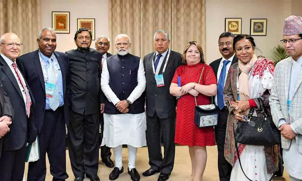 Modi a versatile genius : Who thinks globally, acts locally