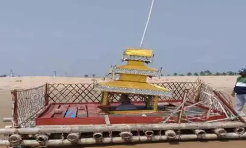 A Bamboo raft reaches seashore of Prakasam beach from Romania