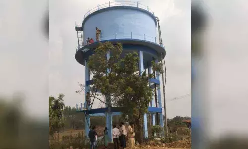 Khammam: Old woman climbs water tank seeking pattadar passbook