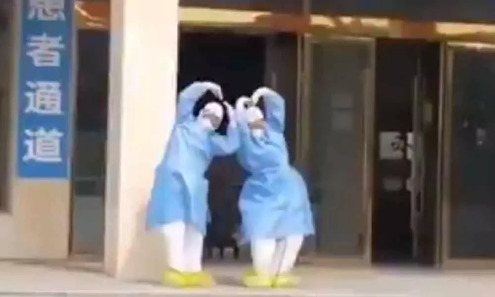 Viral Video: Chinese Medical attendants celebrating Coronavirus recovery in front of the hospital
