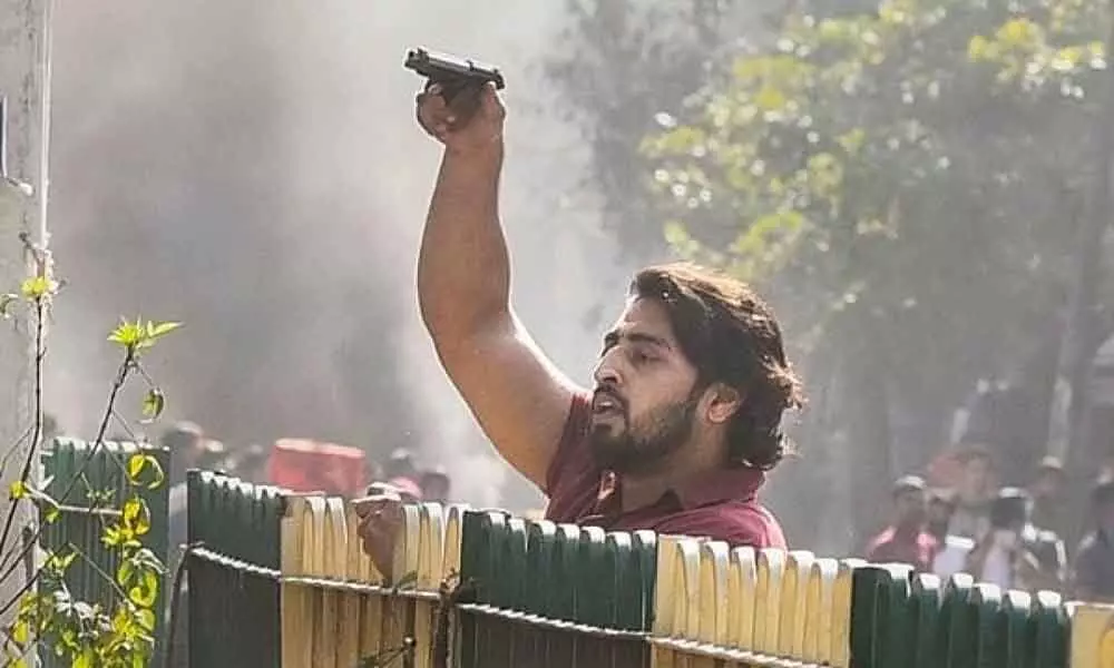 Delhi Violence: Police Hunt For Gun-Wielding Rioter