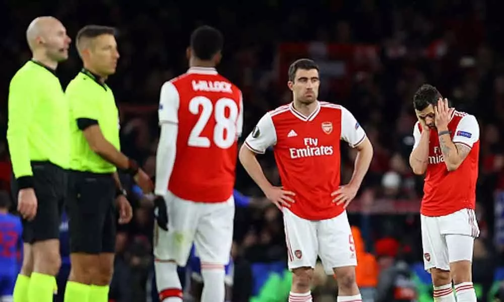 Arsenal knocked out of Europa League in dying seconds by Olympiakos