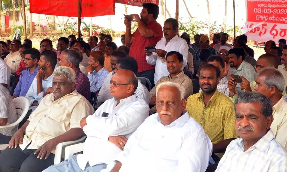 Vijayawada: Postal employees staged a dharna near the Head post office