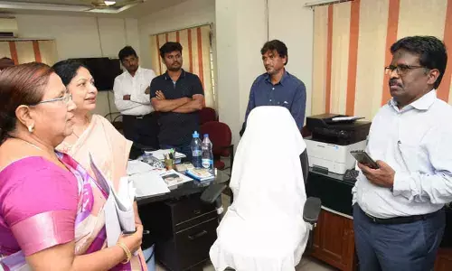 Guntur: Challa Anuradha directed the officials concerned to issue memos to latecomers