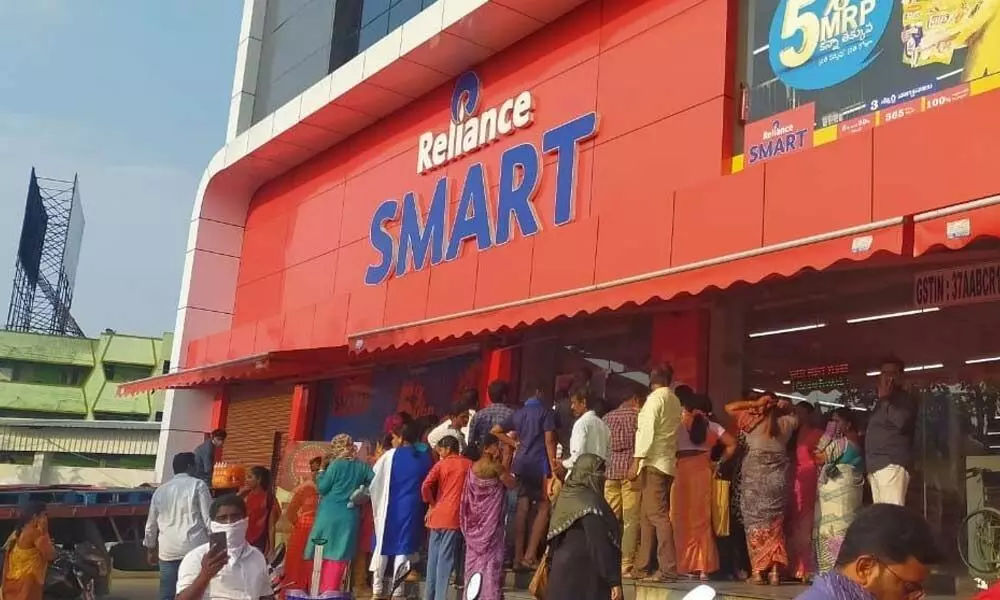 Vizianagaram: People queue up at shops, hypermarkets to buy groceries