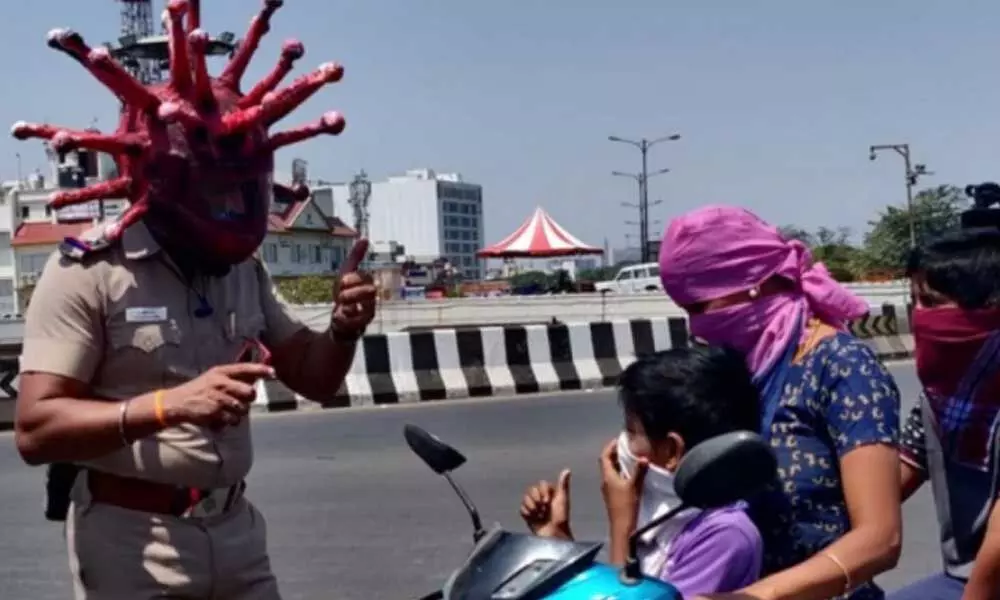 Chennai police wear a corona helmet to create awareness on COVID-19 lockdown