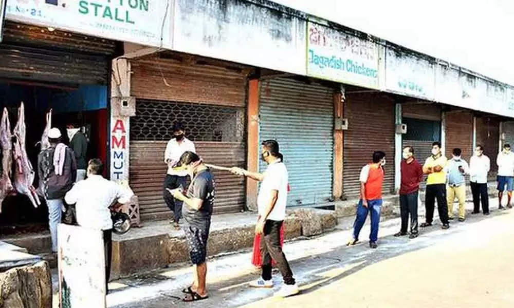 Tirupati: People throng meat shops violating Covid restrictions