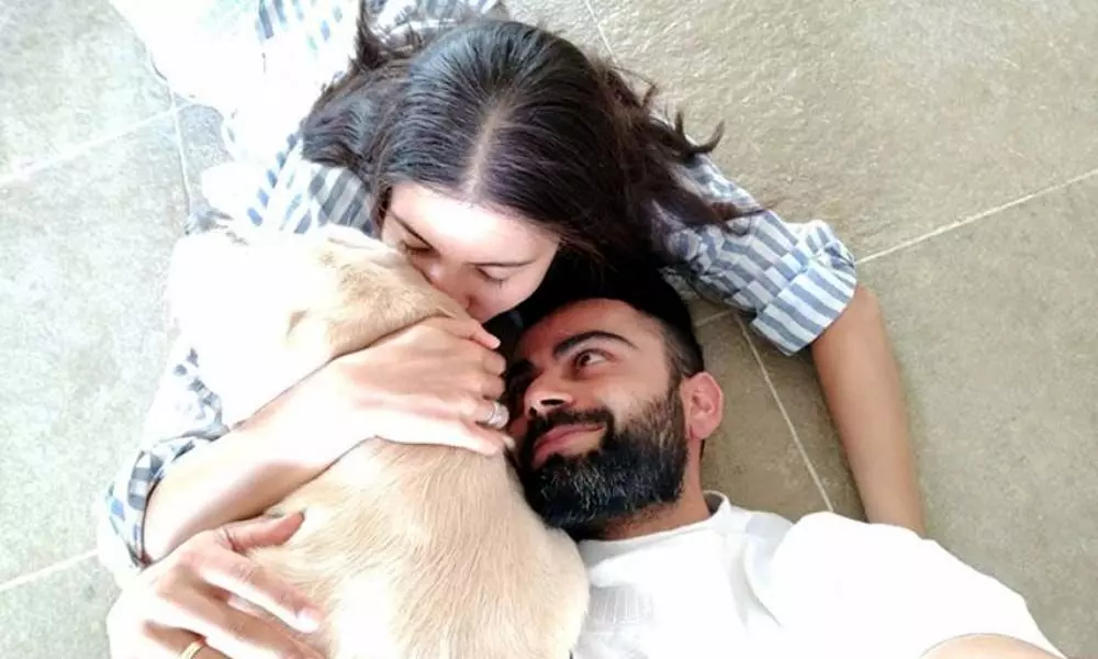 Virat Kohli Couldnt Stop Himself From Sharing Anushkas Photo Of Kissing Their Pet Dog
