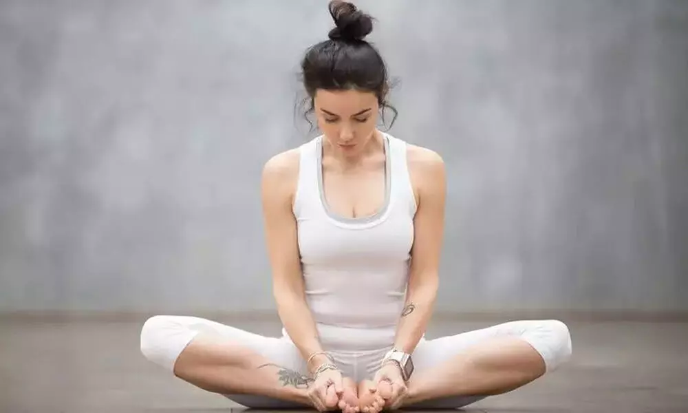 Ease menstrual discomfort with yoga