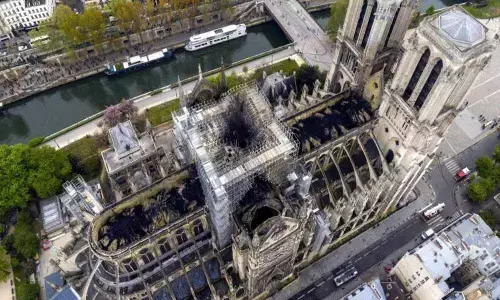 A year after fire, Notre Dames restoration suspended due to COVID-19 outbreak