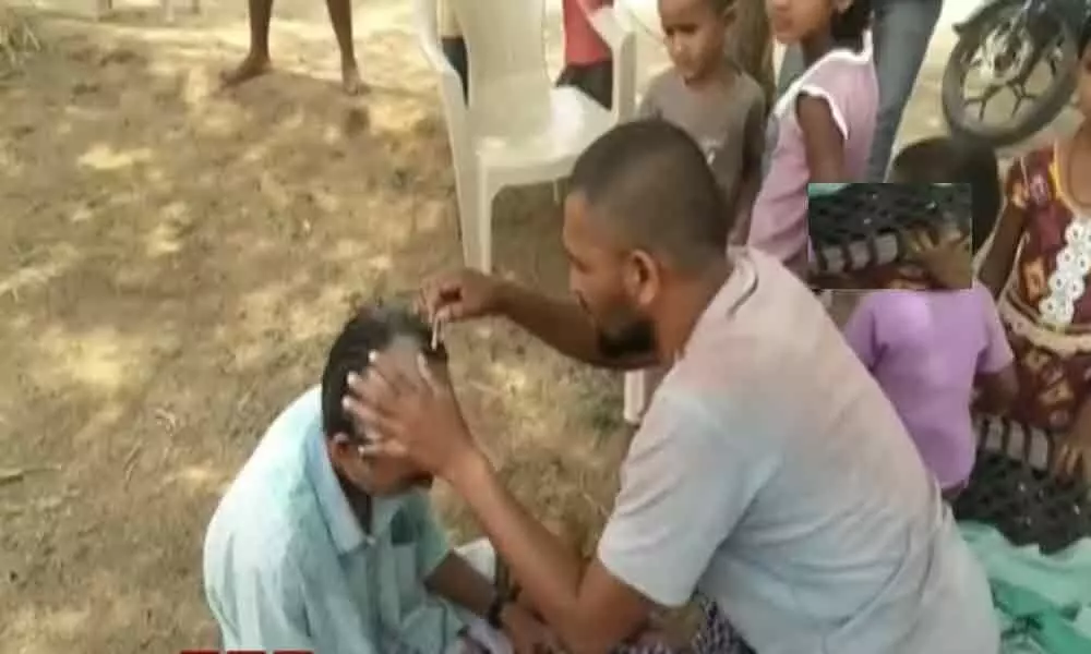 People shave heads in Nirmal to avoid being infected with coronavirus