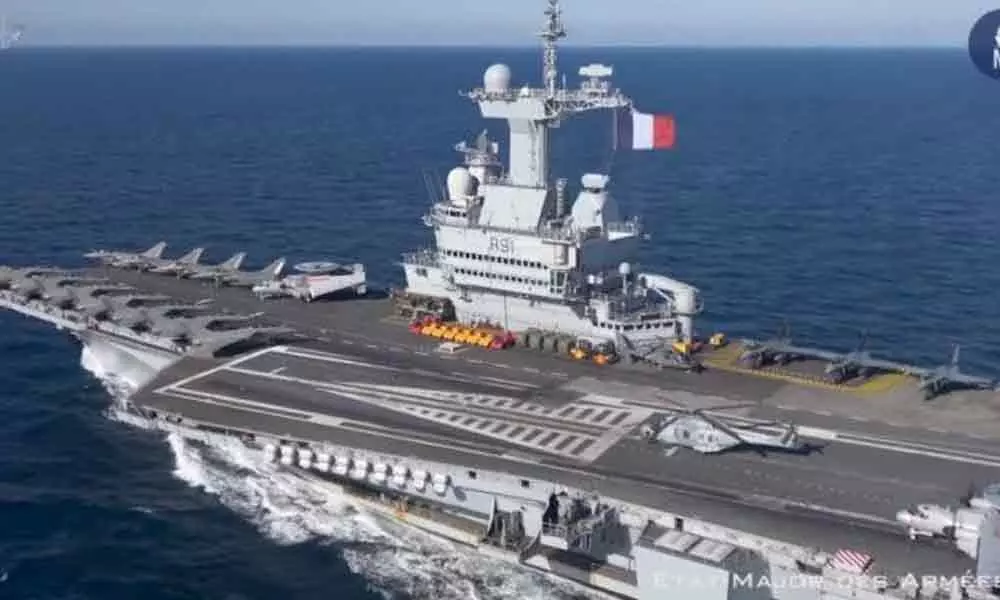 Nearly 700 sailors on board French aircraft carrier test positive