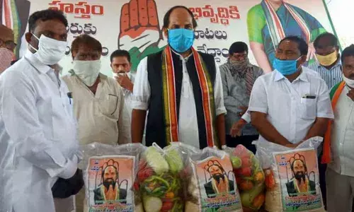 Telangana: Uttam Kumar Reddy distributes grocery items among people hit by lockdown at Huzurnagar in Suryapet