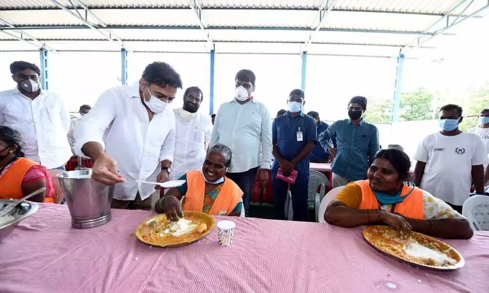 Minister KTR joins sanitation, DRF staff for lunch in Hyderabad