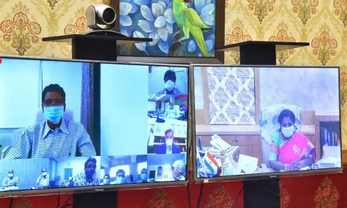 Telangana Governor Dr Tamilisai Soundararajan confers with university registrars