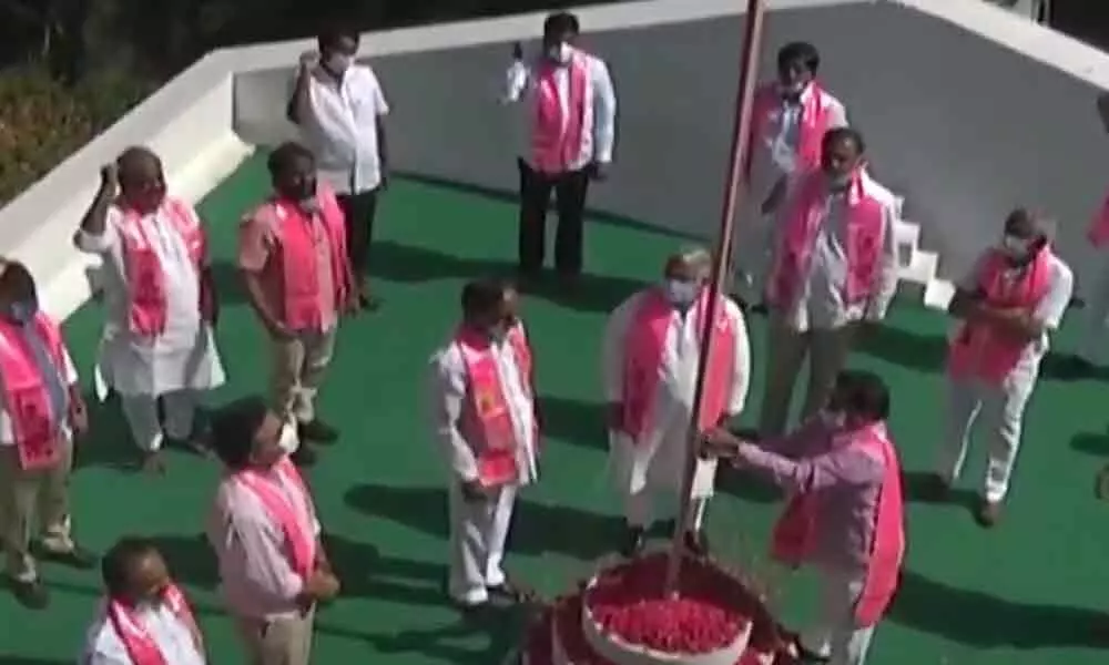 CM KCR hoists party flag on 20th TRS formation day at Telangana Bhavan