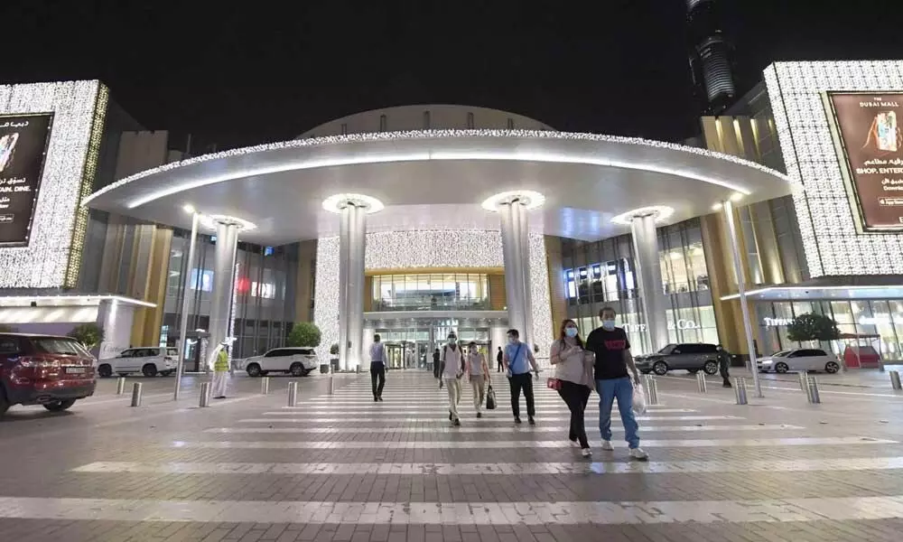 With fever checks and masks, worlds largest mall in Dubai reopens