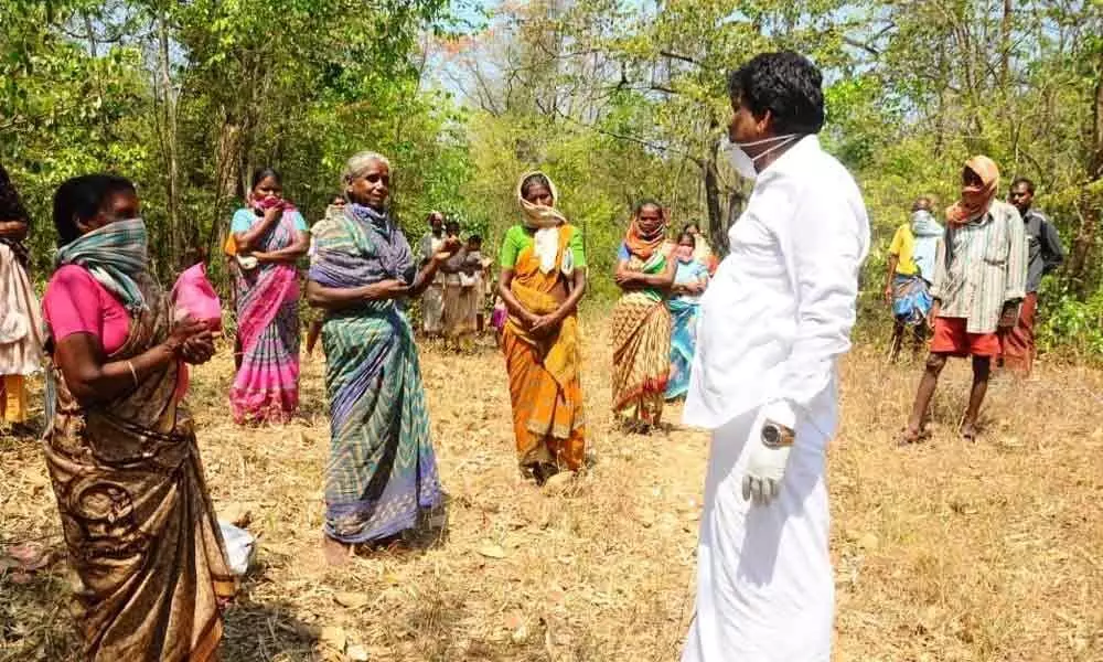 Srikalahasti MLA B Madhusudhan Reddy distributes essentials to tribals in Sadasivakona forest area