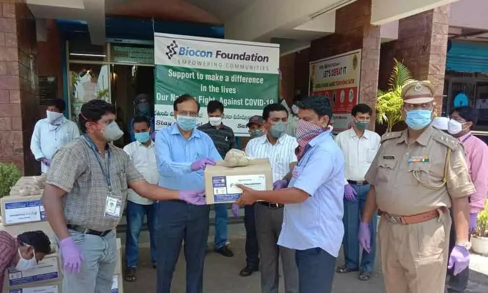 Visakhapatnam: Biocon, Gland Pharma distribute groceries to frontline staff in VSEZ