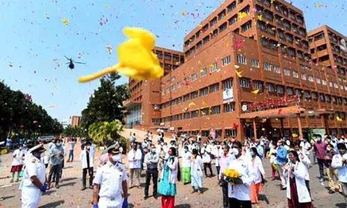 ENC showers flower petals on Coronavirus warriors in Visakhapatnam