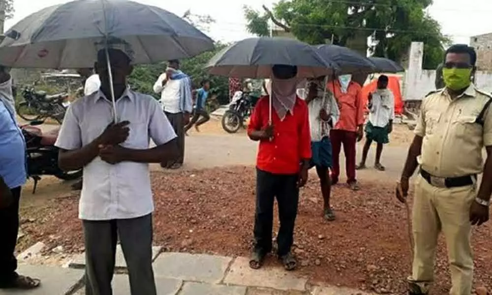 Using umbrella made mandatory to buy liquor in Srikakulam