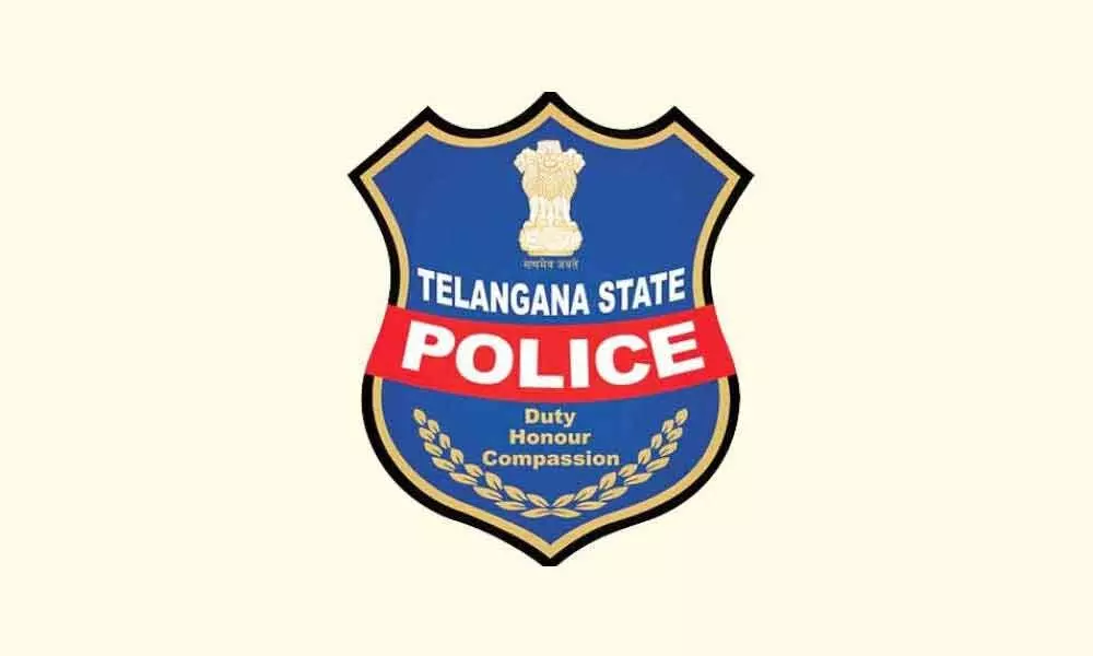 Telangana cop clarifies on being clicked with liquor bottles