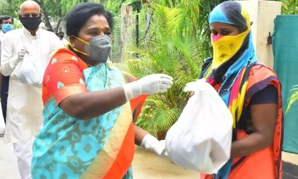 Telangana Governor Dr Tamilisai Soundararajan distributes fruits kits to Raj Bhavan class IV employees