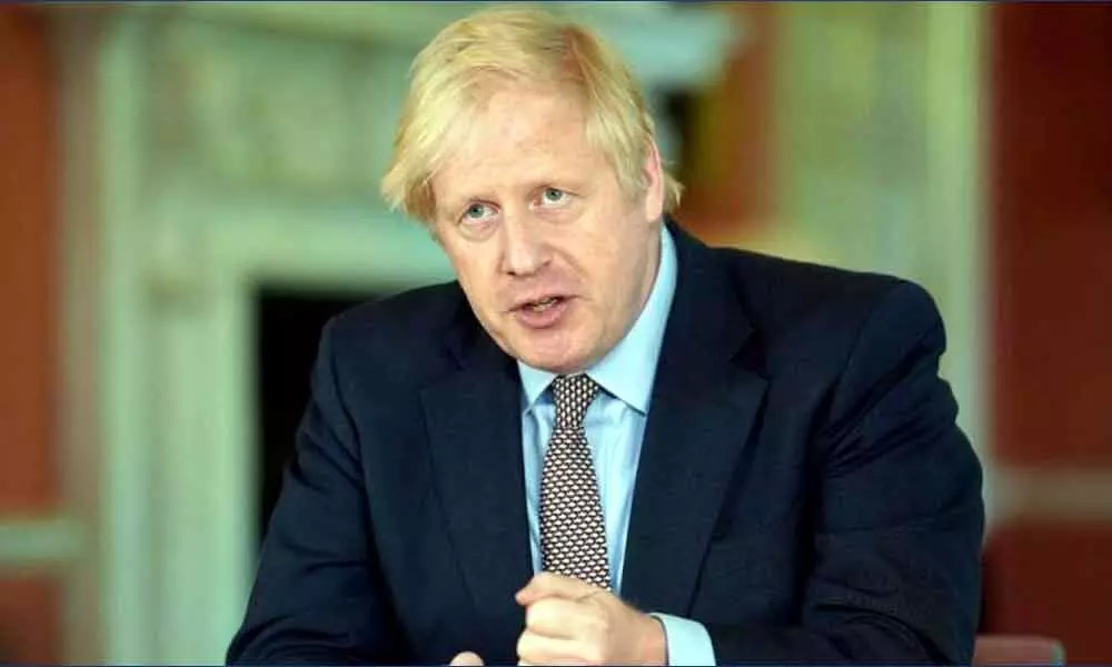 UK PM Boris Johnson launches new COVID-19 alert system as lockdown rules modified
