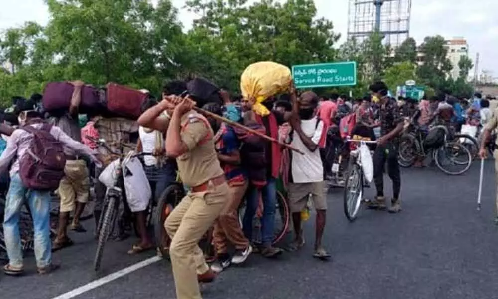 Police canes migrant workers at Tadepalli in Andhra Pradesh