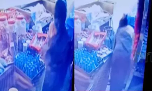 Women caught on CCTV while stealing groceries from a closed shop in Tirumala
