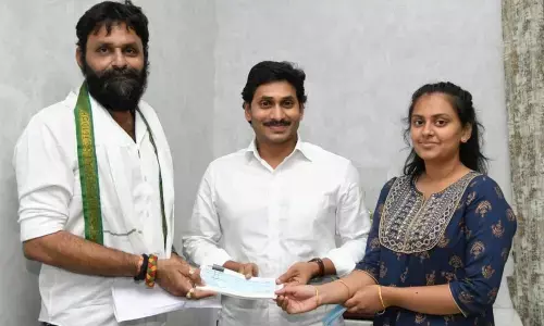 Vijayawada: Minister Kodali Venkateswara Rao presents cheque to CM YS Jagan for CMRF