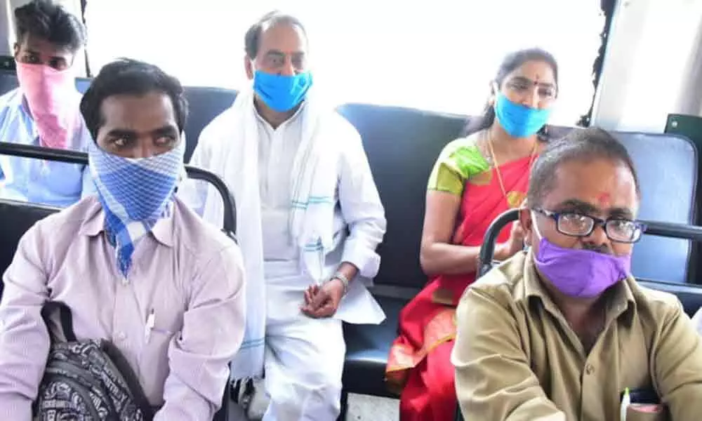Minister inspects COVID-19 safety norms, takes a bus ride in Nirmal