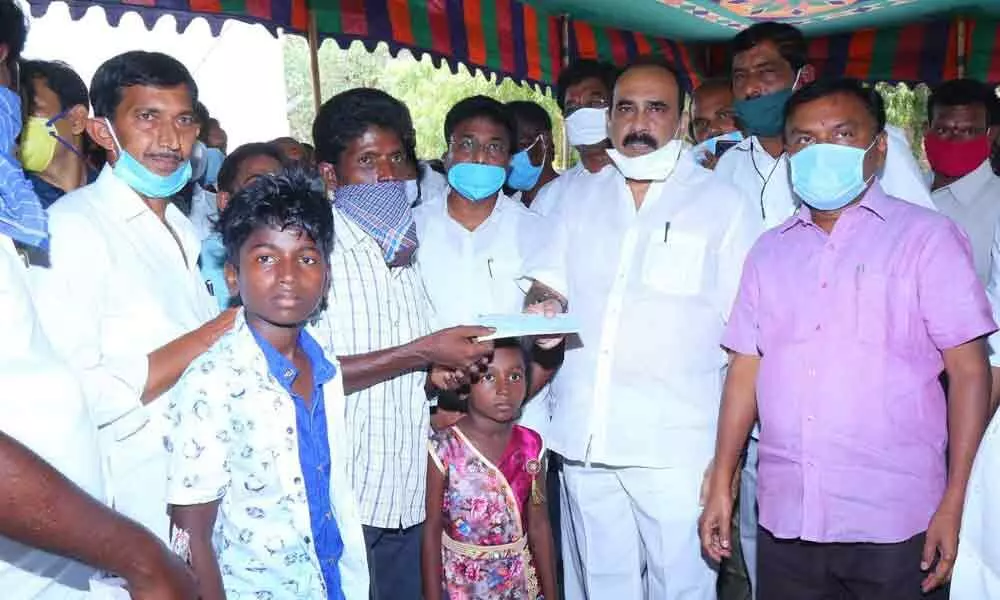 Balineni Srinivas Reddy distributes ex-gratia cheques to kin of Kothapatnam road accident victims
