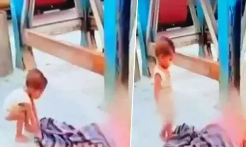 Baby plays with dead mom; video goes viral