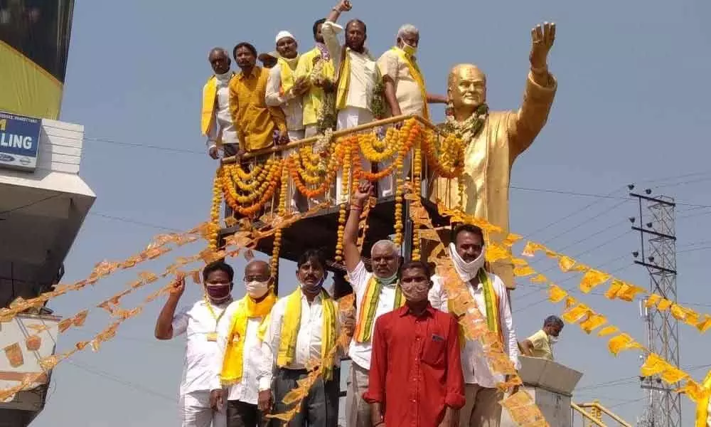 TDP leaders paying tributes after garlanding NTR statue in Karimnagar on Thursday