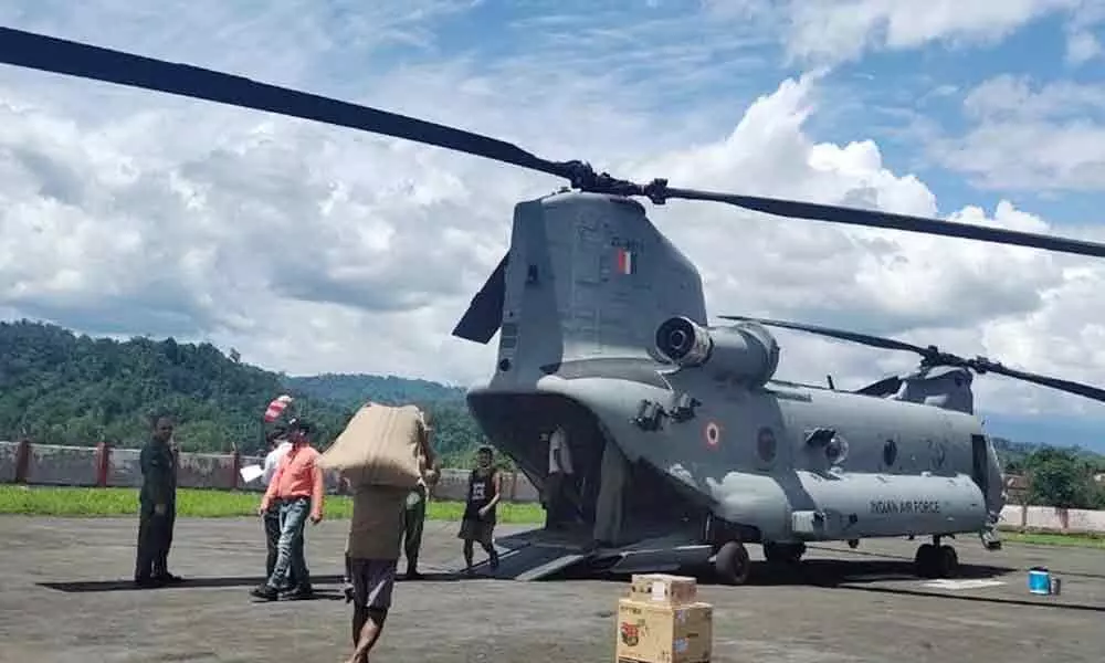Indian Air Force Chinook helicopter being loaded with essential supplies