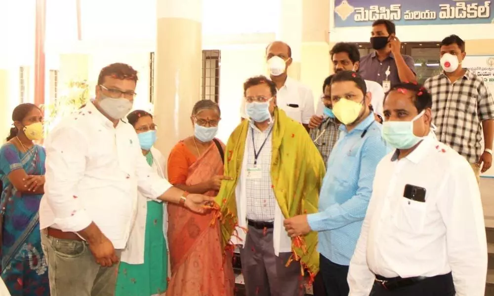 Arcot Krishna Prasad of Walkers International felicitating doctors on Covid duty at Ruia Hospital in Tirupati on Saturday