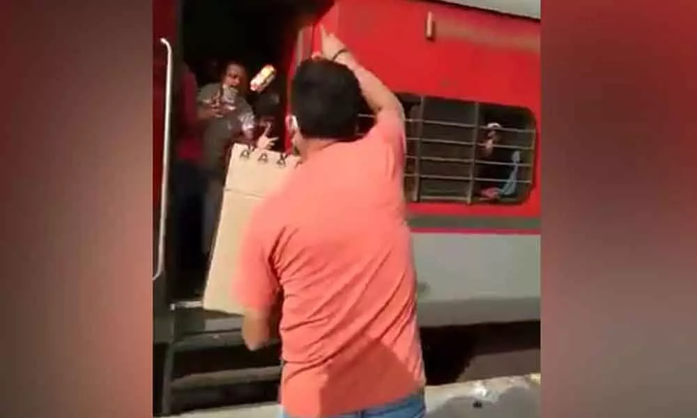 Railway officer throws biscuits at migrants, abuses them