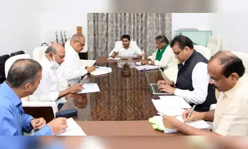 CM YS Jagan Mohan Reddy addressing a review on e-cropping and e-marketing with officials at his camp office
