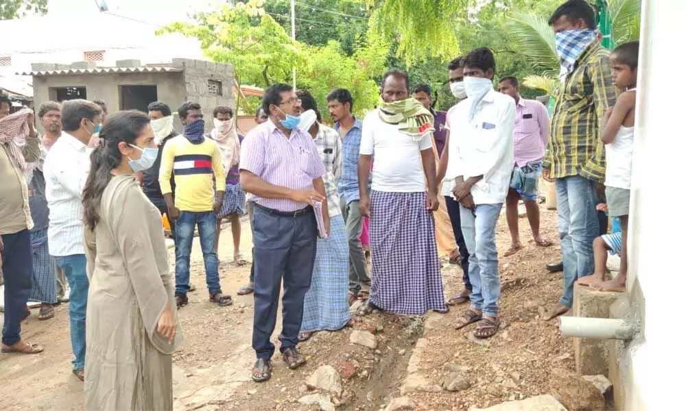 District Collector Sruthi Ojha speaking to the villagers about the need to improve sanitation in Parumala village on Monday