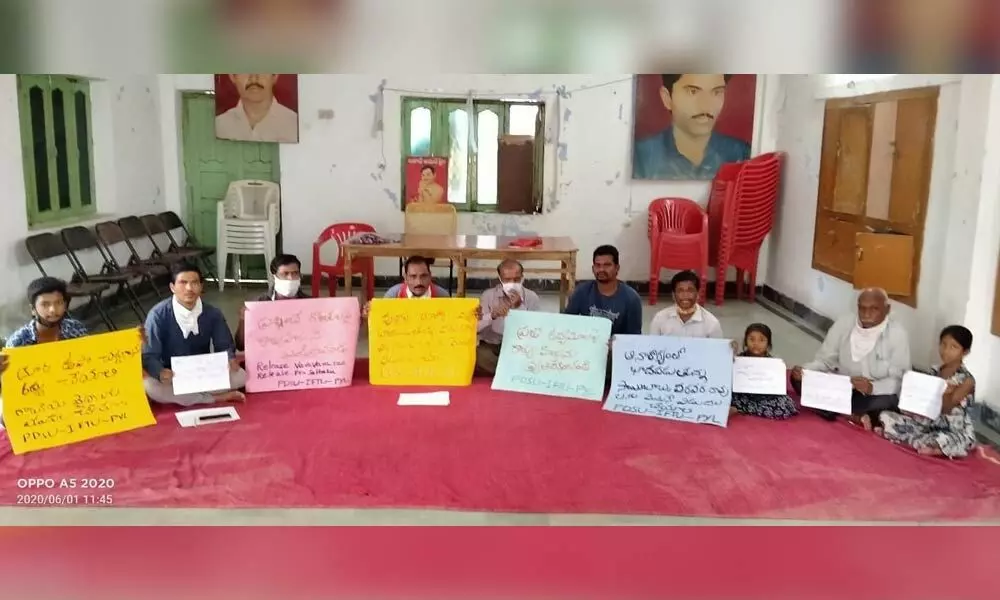 PDSU, IFTU and PLY members staging a protest at Kotagalli NR Bhavan in Nizamabad on Monday