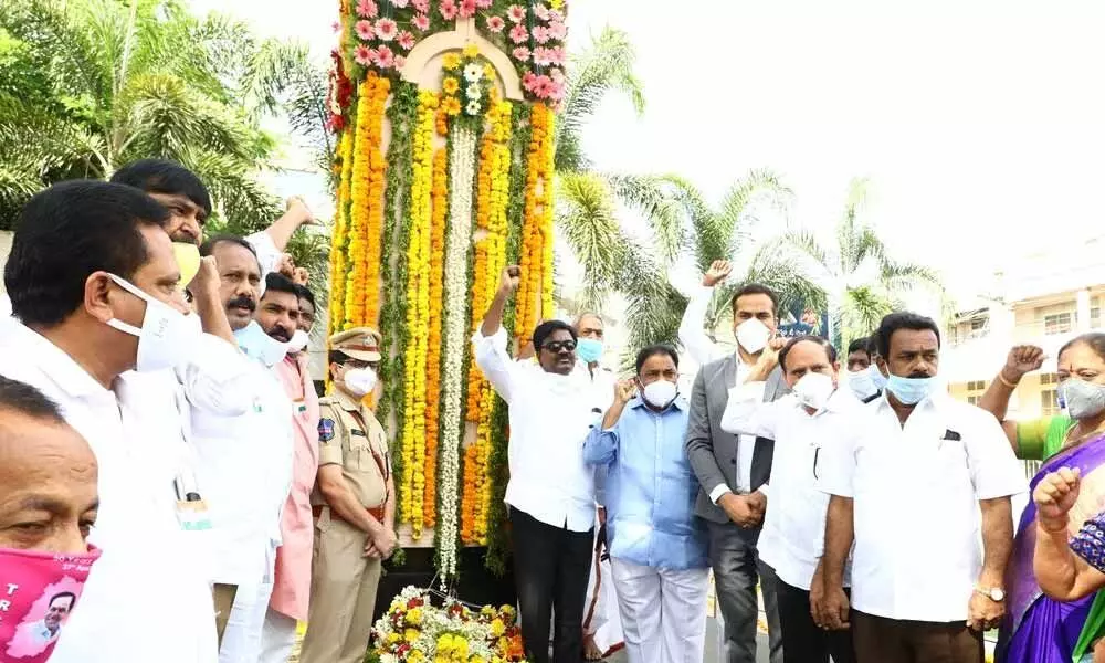 Transport Minister Puvvada Ajay Kumar, Collector RV Karnan and officials paying tributes to Telangana Martyrs in Khammam on Tuesday