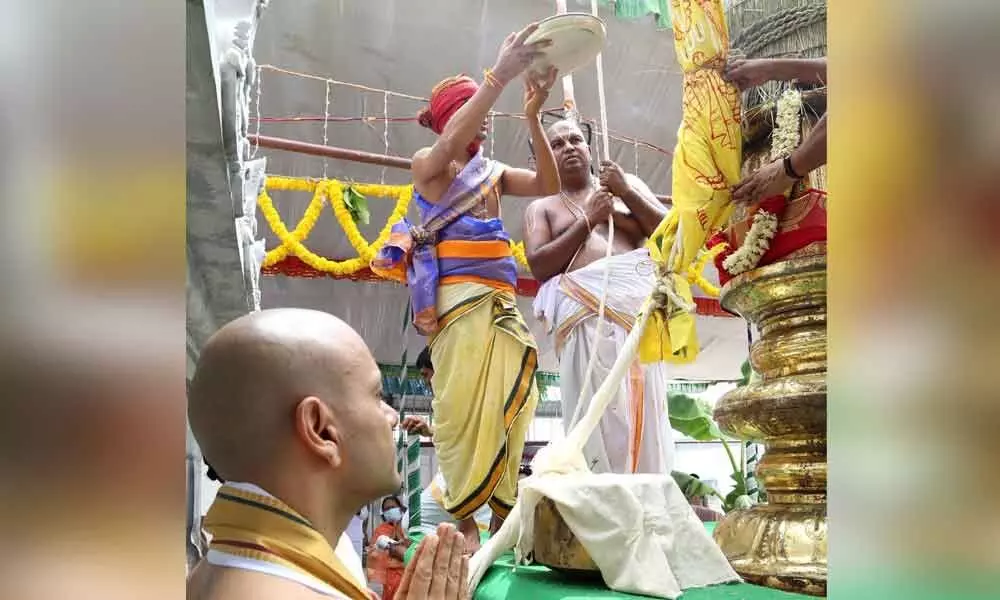 Priests hoisting Garuda flag to mark Dwajarohanam on the first day of annual Brahmotsavams