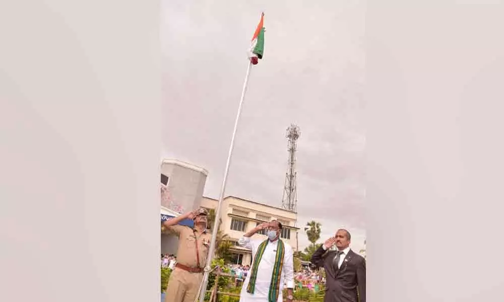Legislative Council Chairman Gutha Sukender Reddy saluting to the national flag at Nalgonda Collectorate on Tuesday. District Collector Prashanth Jeevan Patil and SP Ranganath also seen