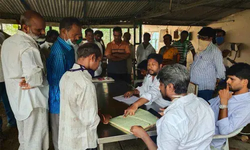Jana Sena Party leaders holding discussions with workers at MetCore industry in Srikakulam district