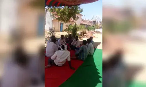 Village Development Committee members staging a protest in front of Goud community chief’s house in Oddepally village on Friday